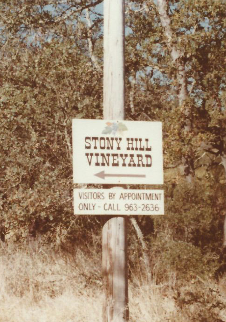 A sign on a post that says "Stony Hill Vineyard", directing guests to the vineyard.