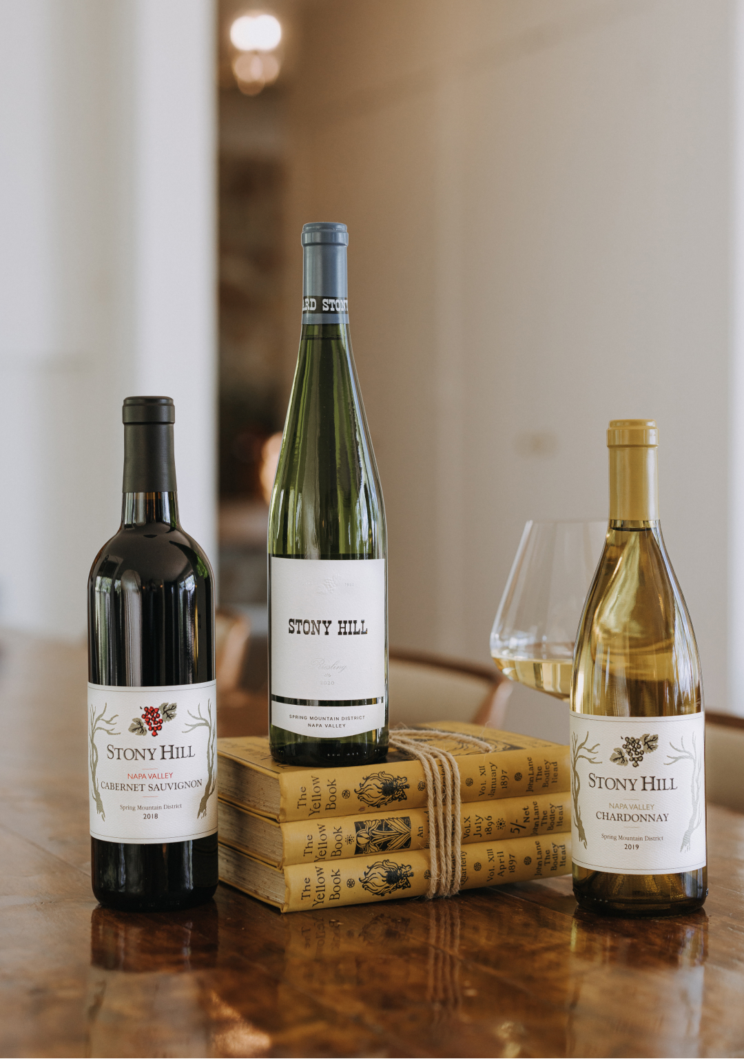 Three bottles of Stony Hill wine on a table inside the Stony Hill residence.