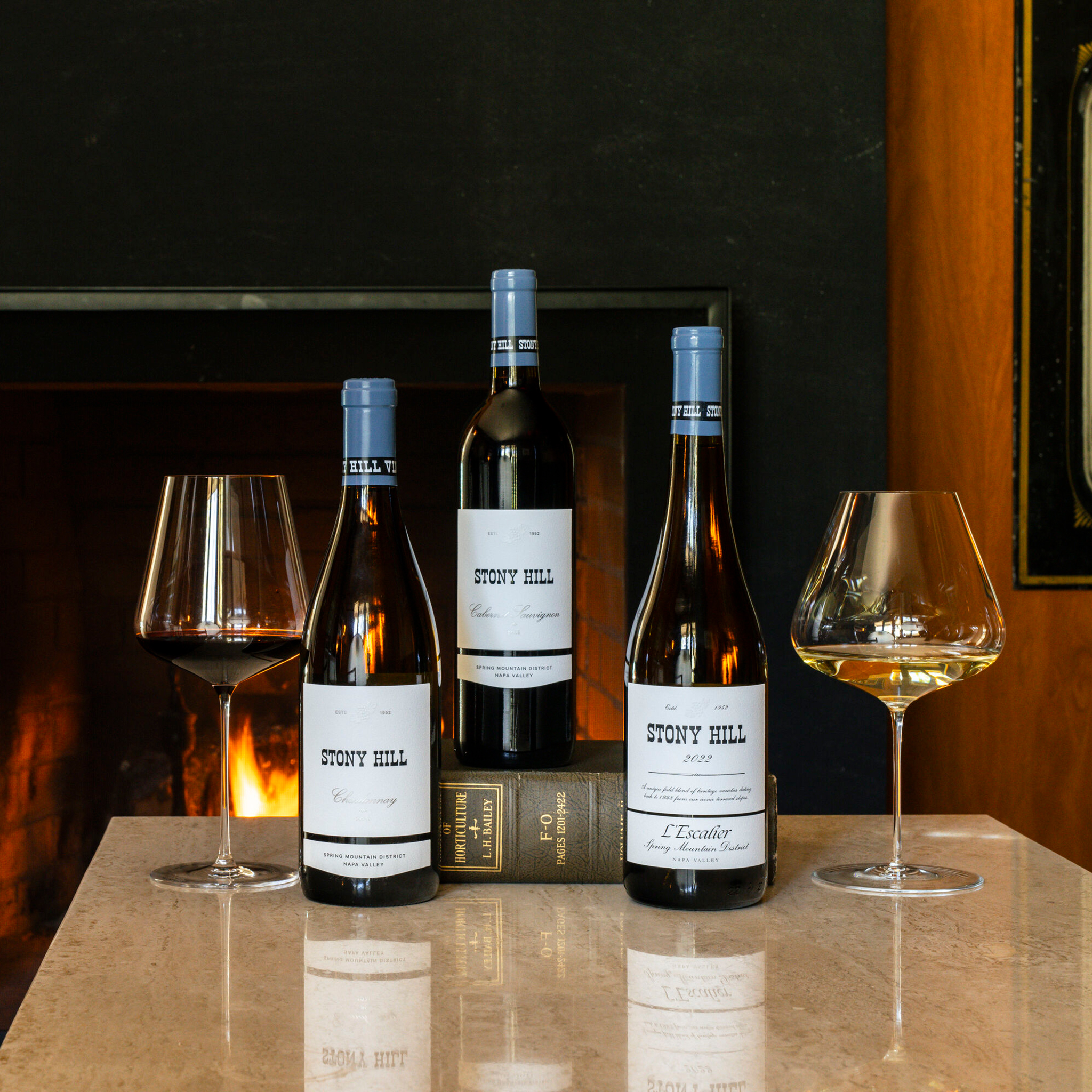 Stony Hill Current Vintage Selections: A bottle of 2021 Chardonnay, 2022 Estate Cabernet Sauvignon, and 2022 L'Escalier.