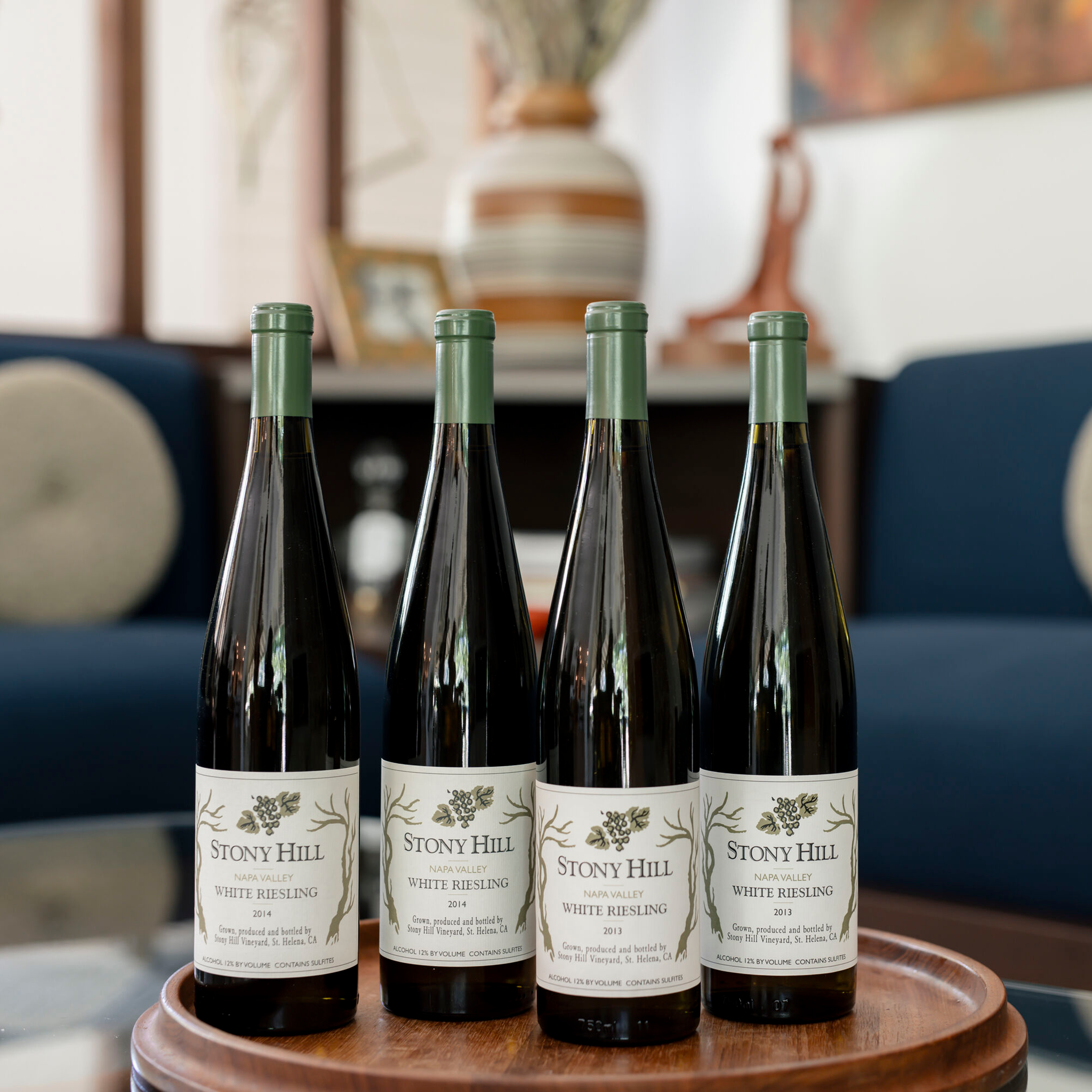 Stony Hill Library Riesling: 2 bottles of 2013 Estate Riesling, and 2 bottles of 2014 Estate Riesling on a table.